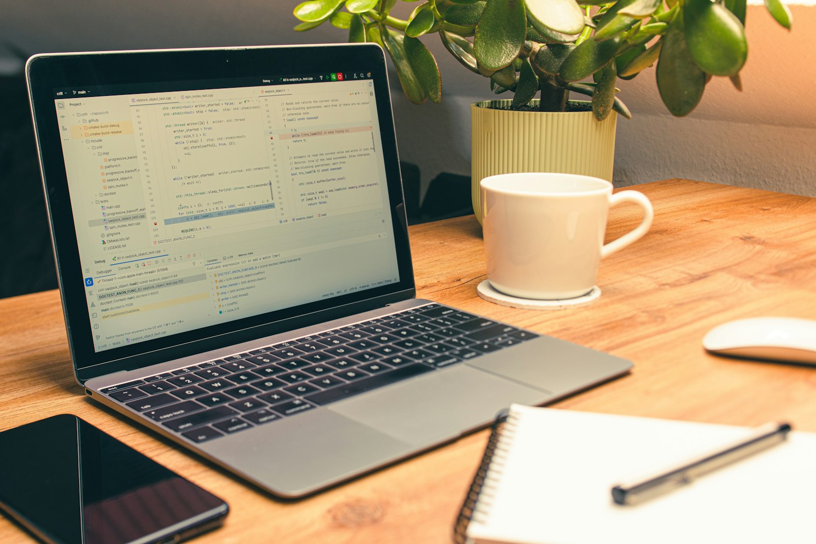 Developer workspace with laptop running code